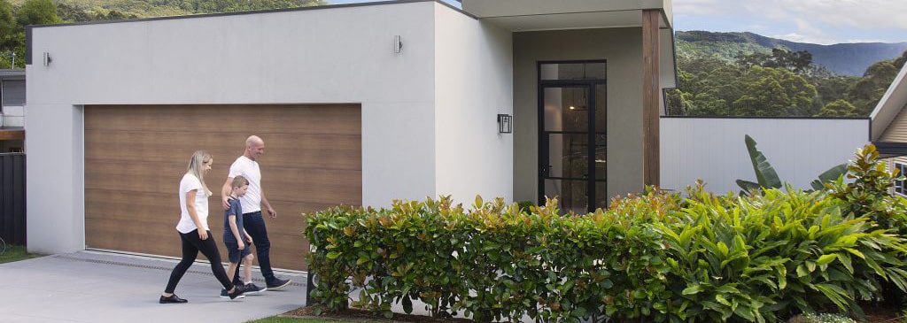 Family walking towards a custom-built Adlington Homes residence